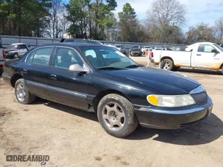 1999 Lincoln Continental with VIN 1LNHM97V8XY686521, listed as a IAAI auction lot 41681027 with 144,407 mi miles. Bid and sale history available at carsss.com. Image 1.