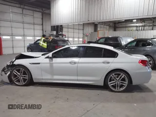 2014 BMW 6 Series 650i xDrive z VIN WBA6B4C55ED371378, wystawiony jako IAAI lot #41640888 z przebiegiem 80 927 mil mil oraz . Historia ofert i sprzedaży dostępna na DreamBid. Obrazek 14.