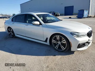 2017 BMW 7 Series 750i with VIN WBA7F0C39HGM22030, listed as a Copart auction lot 87127484 with 110,634 mi miles and Salvage title. Bid and sale history available at DreamBid. Image 4.