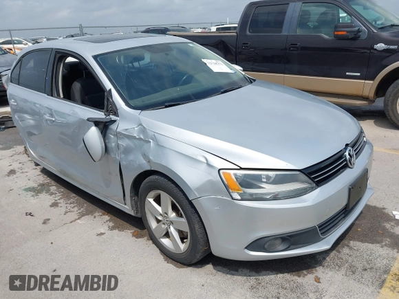 2012 Volkswagen Jetta TDI w/Premium & Nav with VIN 3VWLL7AJXCM359181, listed as a IAAI auction lot 42110771 with 148,547 mi miles and . Bid and sale history available at DreamBid. Image 1.