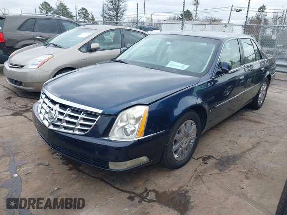 2009 Cadillac DTS 1SA z VIN 1G6KD57Y19U137656, wystawiony jako IAAI lot #41531439 z przebiegiem 103 151 mil mil oraz . Historia ofert i sprzedaży dostępna na DreamBid. Obrazek 2.