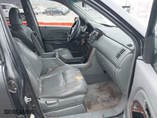 2004 Honda Pilot EX with VIN 2HKYF18644H516791, listed as a IAAI auction lot 41876348 with 291,358 mi miles. Bid and sale history available at carsss.com. Image 5.