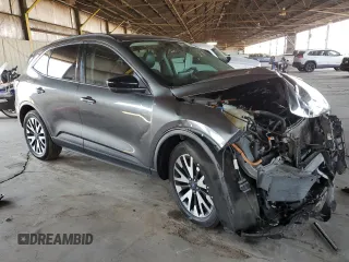 2020 Ford Escape SE Sport Hybrid z VIN 1FMCU9BZ0LUA63674, wystawiony jako Copart lot #59689745 z przebiegiem 157 935 mil mil oraz Szkoda całkowita • Salvage title. Historia ofert i sprzedaży dostępna na DreamBid. Obrazek 4.