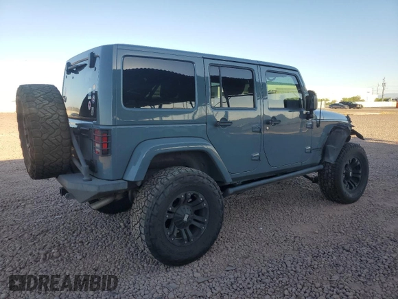 2014 Jeep Wrangler Unlimited Rubicon with VIN 1C4HJWFG9EL199501, listed as a Copart auction lot 61443595 with 86,940 mi miles and Salvage title. Bid and sale history available at DreamBid. Image 3.