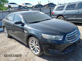 2014 Ford Taurus SEL z VIN 1FAHP2E81EG149126, wystawiony jako IAAI lot #42193359 z przebiegiem 241 834 mil mil oraz . Historia ofert i sprzedaży dostępna na DreamBid. Obrazek 1.