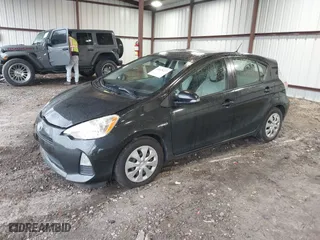 2014 Toyota Prius c One with VIN JTDKDTB39E1066523, listed as a IAAI auction lot 41620227 with 110,000 mi miles. Bid and sale history available at carsss.com. Image 17.