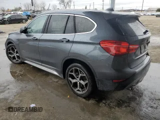 2016 BMW X1 xDrive28i with VIN WBXHT3C31G5E55041, listed as a Copart auction lot 48928705 with 104,799 mi miles and Salvage Title. Bid and sale history available at carsss.com. Image 2.