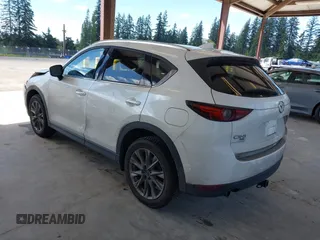 2020 Mazda CX-5 Grand Touring with VIN JM3KFBDM2L0863944, listed as a IAAI auction lot 42150805 with 63,932 mi miles and . Bid and sale history available at DreamBid. Image 3.