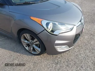 2012 Hyundai Veloster w/Gray Int z VIN KMHTC6AD1CU081754, wystawiony jako IAAI lot #42421889 z przebiegiem 99 593 mil mil oraz . Historia ofert i sprzedaży dostępna na DreamBid. Obrazek 6.