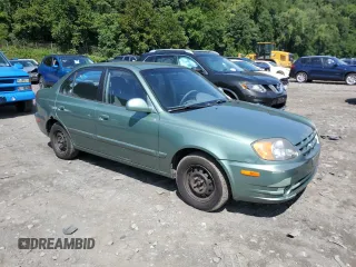 2005 Hyundai Accent GLS with VIN KMHCG45C35U622963, listed as a Copart auction lot 68292114 with 137,655 mi miles and Salvage Title. Bid and sale history available at carsss.com. Image 4.