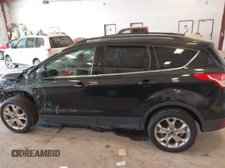 2014 Ford Escape SE with VIN 1FMCU9G95EUA16328, listed as a IAAI auction lot 42464235 with 108,570 mi miles and . Bid and sale history available at DreamBid. Image 14.