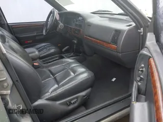 1998 Jeep Grand Cherokee Limited with VIN 1J4GZ78YXWC236969, listed as a IAAI auction lot 41095686 with 182,001 mi miles. Bid and sale history available at carsss.com. Image 5.