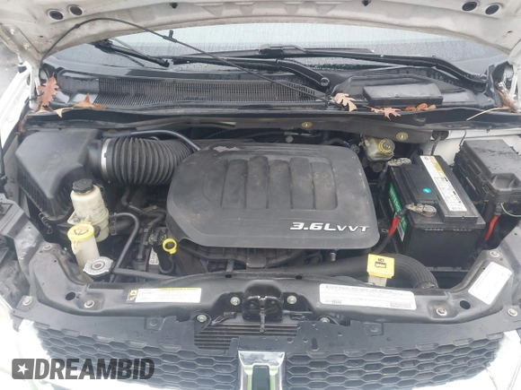 2012 Dodge Grand Caravan SXT with VIN 2C4RDGCG4CR304472, listed as a IAAI auction lot 41396437 with 180,309 mi miles and . Bid and sale history available at DreamBid. Image 10.