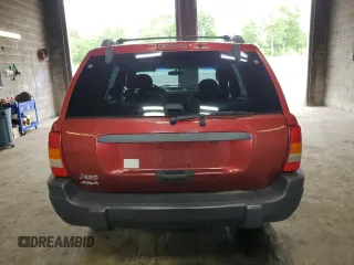 2004 Jeep Grand Cherokee Laredo with VIN 1J4GW48S04C164745, listed as a Copart auction lot 64036725 with 163,054 mi miles and Salvage title. Bid and sale history available at DreamBid. Image 6.