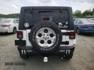 2013 Jeep Wrangler Unlimited Sahara with VIN 1C4HJWEG9DL628684, listed as a Copart auction lot 57672175 with 69,010 mi miles and Salvage title. Bid and sale history available at DreamBid. Image 6.