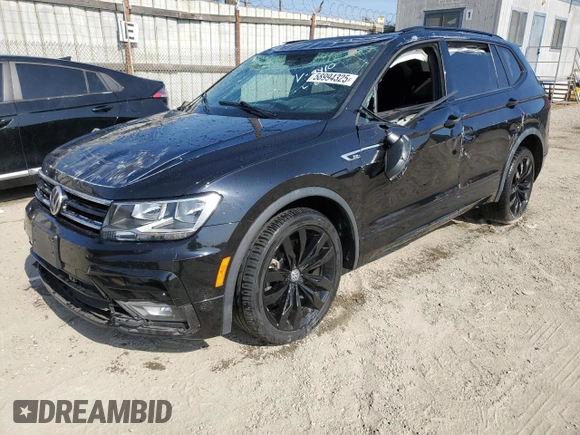 2021 Volkswagen Tiguan SE with VIN 3VV3B7AXXMM069410, listed as a Copart auction lot 58994325 with 55,846 mi miles and Salvage title. Bid and sale history available at DreamBid. Image 1.