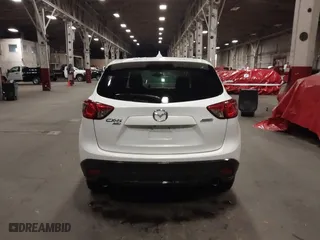 2016 Mazda CX-5 Touring with VIN JM3KE4CY0G0853261, listed as a IAAI auction lot 41861176 with 63,491 mi miles. Bid and sale history available at carsss.com. Image 16.