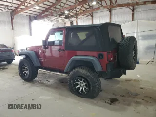 2012 Jeep Wrangler Sport with VIN 1C4AJWAG5CL233049, listed as a Copart auction lot 52328865 with 185,388 mi miles and Salvage title. Bid and sale history available at DreamBid. Image 2.