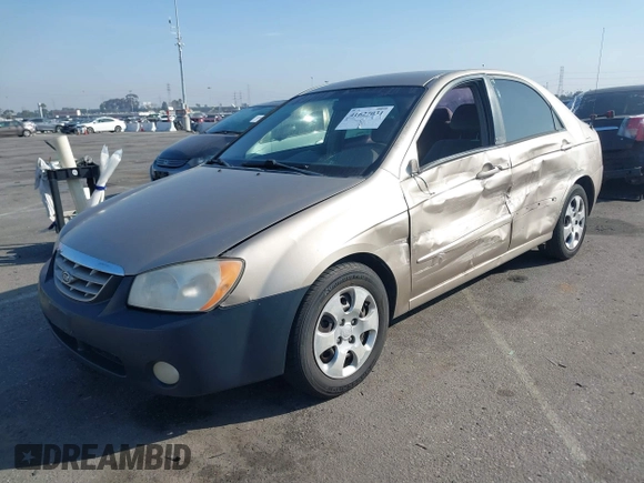 2004 Kia Spectra LX with VIN KNAFE122145013930, listed as a IAAI auction lot 41627031 with 93,565 mi miles. Bid and sale history available at carsss.com. Image 2.