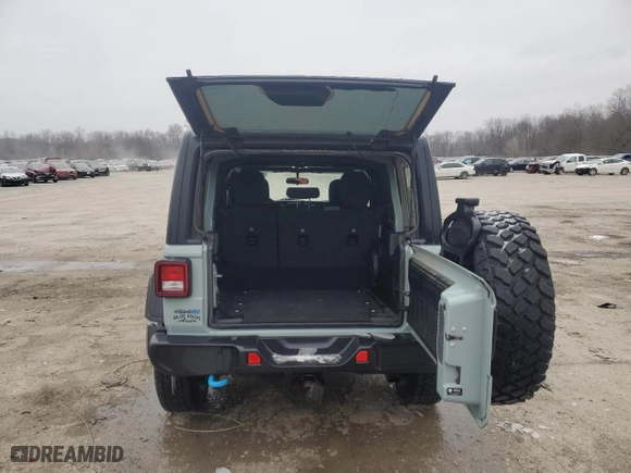 2023 Jeep Wrangler 4xe with VIN 1C4JJXN60PW650963, listed as a Copart auction lot 43717965 with 41,423 mi miles and Salvage Title. Bid and sale history available at carsss.com. Image 6.