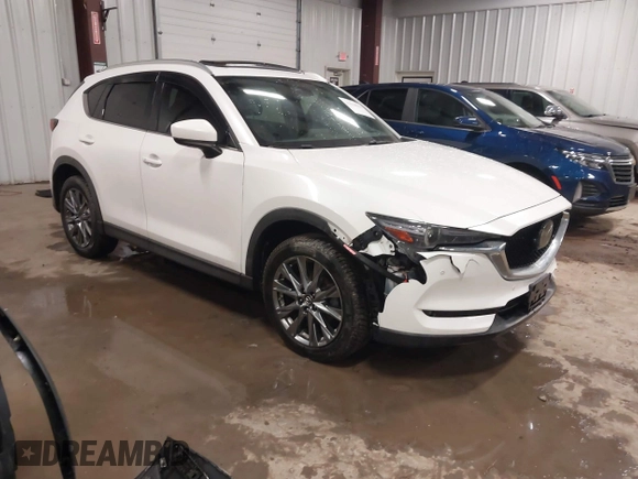 2019 Mazda CX-5 Signature with VIN JM3KFBEY5K0520593, listed as a IAAI auction lot 41638594 with 111,504 mi miles. Bid and sale history available at carsss.com. Image 1.
