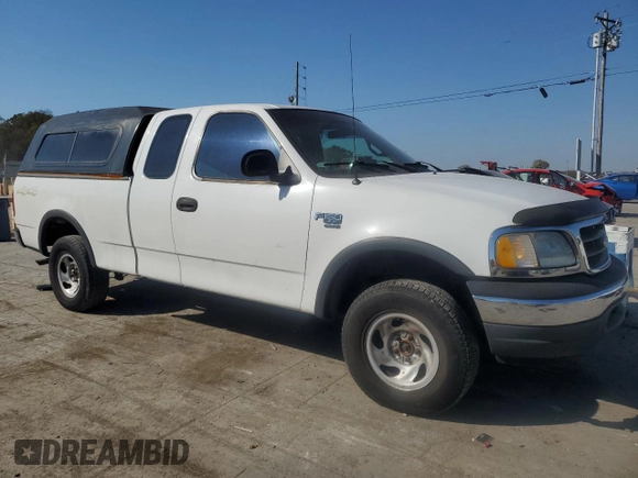 2000 Ford F-150 XL with VIN 1FTRX18W2YNC34320, listed as a Copart auction lot 77832404 with 217,448 mi miles and Clean Title. Bid and sale history available at carsss.com. Image 4.