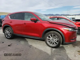 2021 Mazda CX-5 Grand Touring Reserve with VIN JM3KFBAY4M0358478, listed as a Copart auction lot 50839815 with 84,932 mi miles and Salvage Title. Bid and sale history available at DreamBid. Image 4.