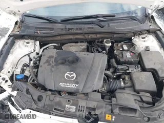 2016 Mazda Mazda3 i Grand Touring with VIN 3MZBM1N77GM319103, listed as a IAAI auction lot 41472772 with 82,833 mi miles. Bid and sale history available at carsss.com. Image 10.
