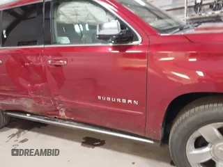 2015 Chevrolet Suburban LTZ z VIN 1GNSKKKC7FR218034, wystawiony jako IAAI lot #41884644 z przebiegiem 160 721 mil mil oraz . Historia ofert i sprzedaży dostępna na DreamBid. Obrazek 6.