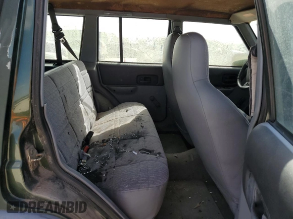 1997 Jeep Cherokee SE with VIN 1J4FT28SXVL540135, listed as a Copart auction lot 77043714 with 0 mi miles and Clean Title. Bid and sale history available at carsss.com. Image 11.