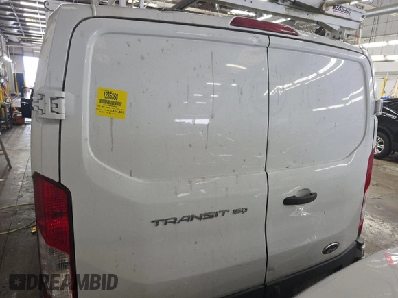 2016 Ford Transit Cargo with VIN 1FTYE1ZM1GKA06047, listed as a IAAI auction lot 42679265 with 124,601 mi miles and . Bid and sale history available at DreamBid. Image 3.