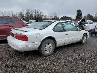 1997 Ford Thunderbird LX with VIN 1FALP62W2VH154138, listed as a Copart auction lot 46281235 with 145,738 mi miles and Clean Title. Bid and sale history available at DreamBid. Image 3.
