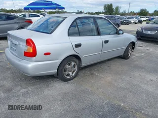 2002 Hyundai Accent GL with VIN KMHCG45C52U378454, listed as a IAAI auction lot 41418653 with 173,564 mi miles. Bid and sale history available at carsss.com. Image 4.