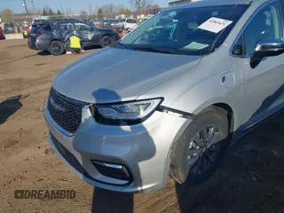 2023 Chrysler Pacifica Hybrid Limited with VIN 2C4RC1S72PR588627, listed as a IAAI auction lot 42063631 with 52,799 mi miles and . Bid and sale history available at DreamBid. Image 6.