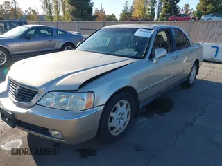 1999 Acura RL with VIN JH4KA9661XC005883, listed as a IAAI auction lot 40560595 with 165,195 mi miles. Bid and sale history available at carsss.com. Image 2.