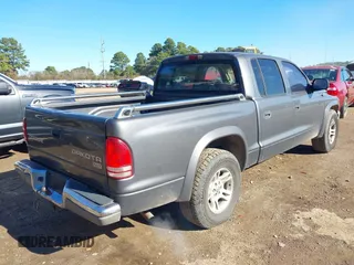 2003 Dodge Dakota SLT with VIN 1D7HL48X03S174569, listed as a IAAI auction lot 41159169 with 156,551 mi miles. Bid and sale history available at carsss.com. Image 4.