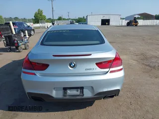 2013 BMW 6 Series 650i z VIN WBAYM9C57DDW20410, wystawiony jako IAAI lot #42348010 z przebiegiem 146 985 mil mil oraz . Historia ofert i sprzedaży dostępna na DreamBid. Obrazek 16.