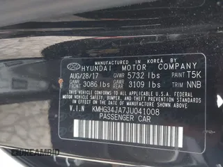 2018 Genesis G90 3.3T Premium with VIN KMHG34JA7JU041008, listed as a IAAI auction lot 41719369 with 146,874 mi miles. Bid and sale history available at carsss.com. Image 9.