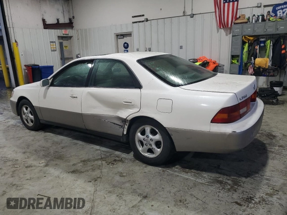 1999 Lexus ES 300 Luxury Sport Sdn with VIN JT8BF28G0X0233986, listed as a Copart auction lot 82440944 with 129,656 mi miles and Salvage Title. Bid and sale history available at carsss.com. Image 2.