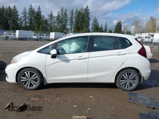 2019 Honda Fit EX z VIN 3HGGK5H88KM716257, wystawiony jako IAAI lot #41936677 z przebiegiem 133 463 mil mil oraz . Historia ofert i sprzedaży dostępna na DreamBid. Obrazek 14.