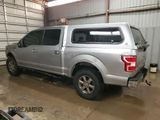 2020 Ford F-150 XL with VIN 1FTEW1E57LKF44499, listed as a Copart auction lot 60336735 with 156,745 mi miles and Salvage title. Bid and sale history available at DreamBid. Image 2.