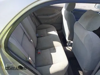 2003 Toyota Corolla CE with VIN 1NXBR32E23Z015648, listed as a IAAI auction lot 42056596 with 287,999 mi miles and . Bid and sale history available at DreamBid. Image 8.