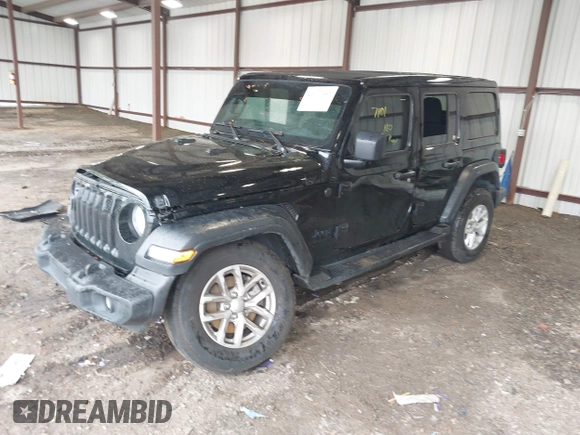 2023 Jeep Wrangler Willys with VIN 1C4HJXDG0PW617101, listed as a IAAI auction lot 42111687 with 56,415 mi miles and . Bid and sale history available at DreamBid. Image 18.