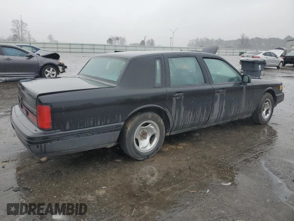 1997 Lincoln Town Car Executive z VIN 1LNLM81W7VY720905, wystawiony jako Copart lot #85910534 z przebiegiem Nie podano mil oraz Szkoda całkowita • Salvage title. Historia ofert i sprzedaży dostępna na DreamBid. Obrazek 3.