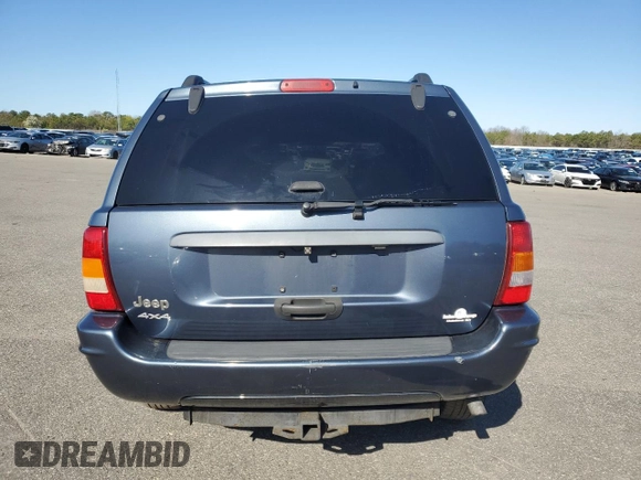 2004 Jeep Grand Cherokee Laredo z VIN 1J4GW48S74C159381, wystawiony jako Copart lot #53972115 z przebiegiem 128 309 mil mil oraz Szkoda całkowita • Salvage title. Historia ofert i sprzedaży dostępna na DreamBid. Obrazek 6.
