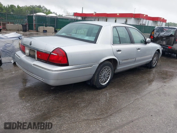 2001 Mercury Grand Marquis GS z VIN 2MEFM74W91X618246, wystawiony jako IAAI lot #42226130 z przebiegiem 125 487 mil mil oraz . Historia ofert i sprzedaży dostępna na DreamBid. Obrazek 4.
