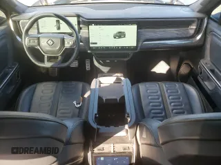 2022 Rivian R1S Launch Edition with VIN 7PDSGABL1NN000514, listed as a Copart auction lot 77444184 with 29,490 mi miles and Salvage Title. Bid and sale history available at DreamBid. Image 8.