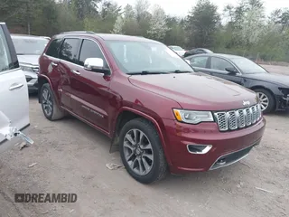 2017 Jeep Grand Cherokee Overland z VIN 1C4RJECG6HC719001, wystawiony jako IAAI lot #41795517 z przebiegiem 103 076 mil mil oraz . Historia ofert i sprzedaży dostępna na DreamBid. Obrazek 1.