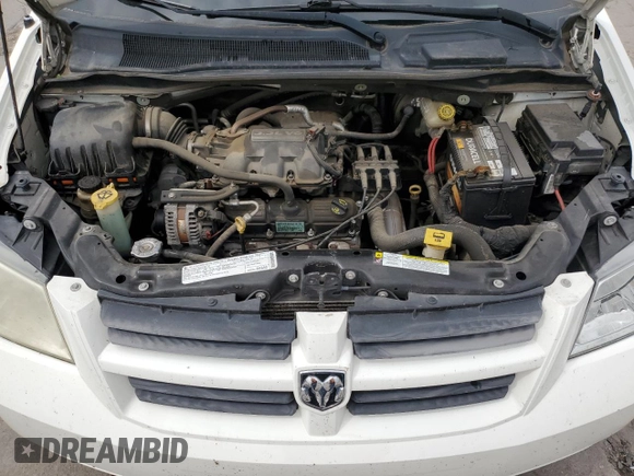 2009 Dodge Grand Caravan SE z VIN 2D8HN44EX9R533530, wystawiony jako Copart lot #59548375 z przebiegiem 130 956 mil mil oraz Szkoda całkowita • Salvage title. Historia ofert i sprzedaży dostępna na DreamBid. Obrazek 12.