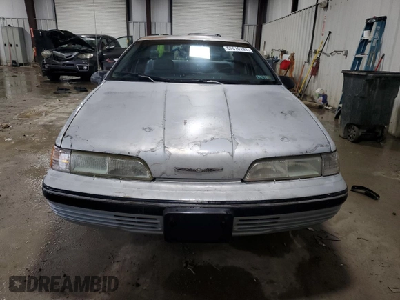 1990 Ford Thunderbird with VIN 1FAPP6047LH140817, listed as a Copart auction lot 83910194 with 177,909 mi miles and Salvage Title. Bid and sale history available at DreamBid. Image 5.